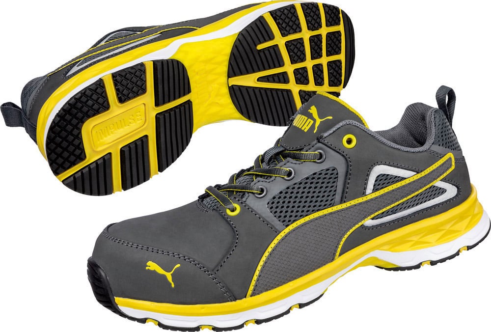Grey and yellow sports trainers, a side view and a bottom view. Distinctive design with yellow Puma logo.