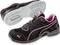 Black sports trainers with pink accents and a light-coloured sole, side and top view. Designed for comfort and style during running.