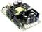 An open switch-mode power supply with a transformer, capacitors and other electronic components mounted on a circuit board.