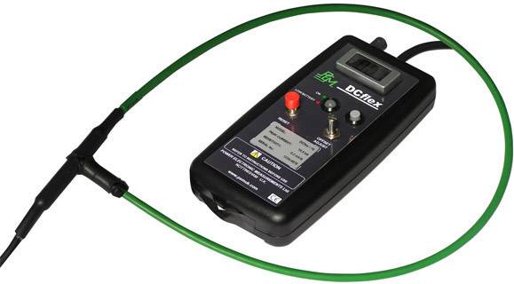 A handheld measuring device with a green cable for recording electrical values. Display, controls, and connections visible.