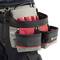 Tool belt with multiple pockets, filled with various tools. A person is wearing the belt. Ideal for tradespeople.
