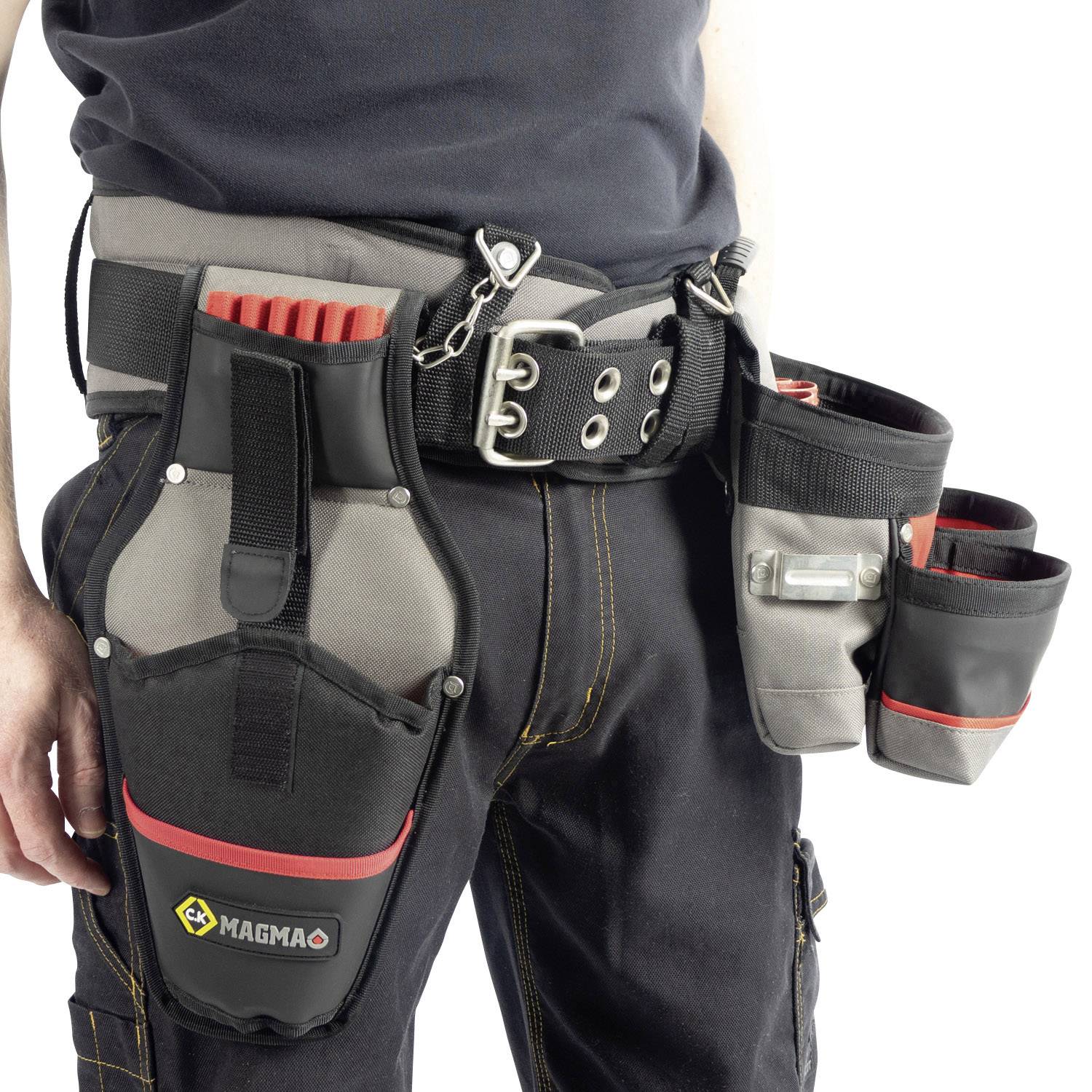 A tool belt with multiple pockets, filled with screwdrivers and other tools, is worn by a worker around the waist.