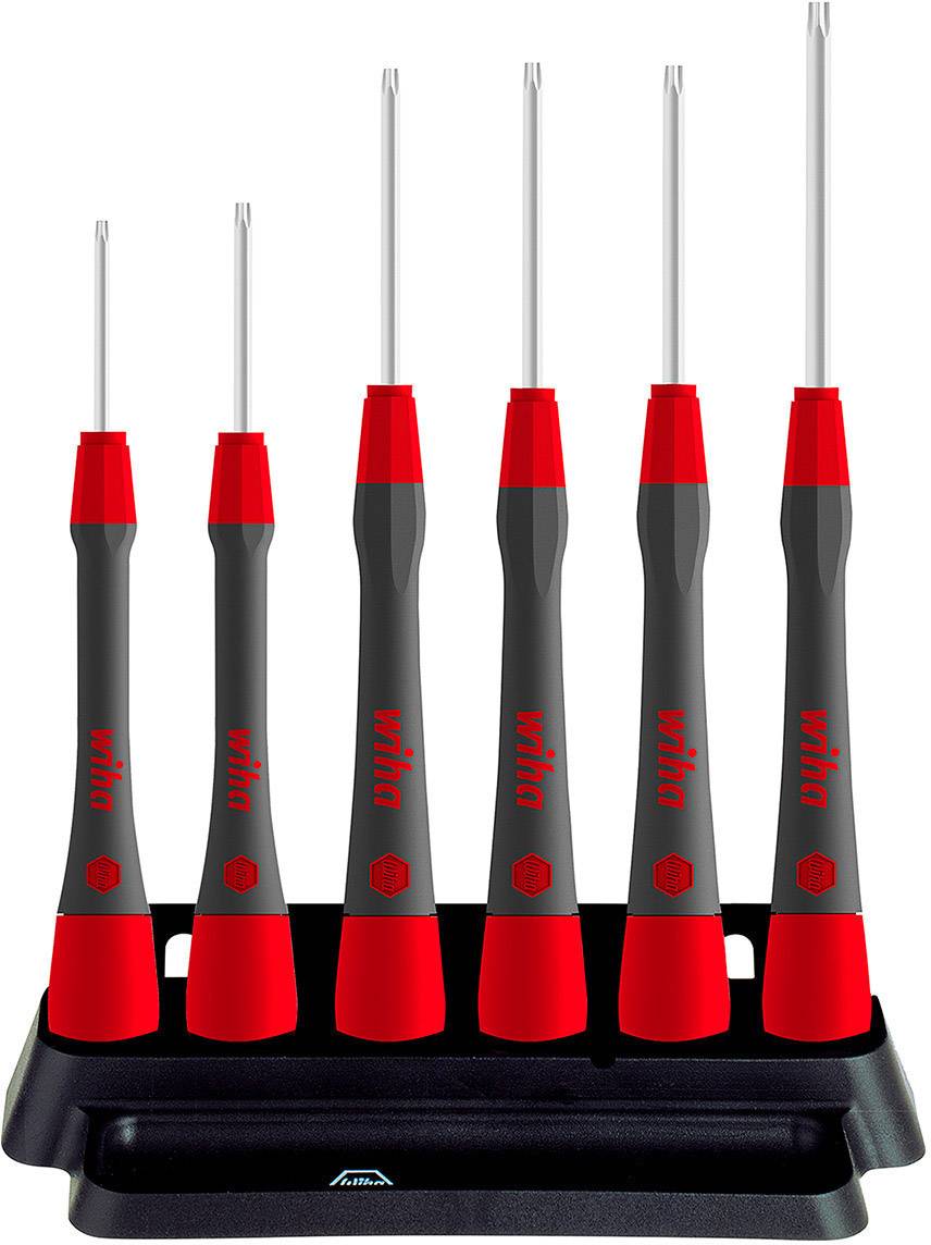 A set of six screwdrivers in various sizes, black and red, stands on a black stand. Suitable for precision work.