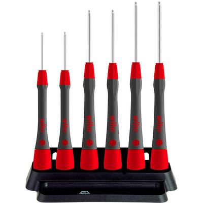 Six precision screwdrivers with red and black handles are standing in a black holder.