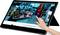A tablet is being used, with a hand pointing, to browse a website featuring electronic devices and accessories.