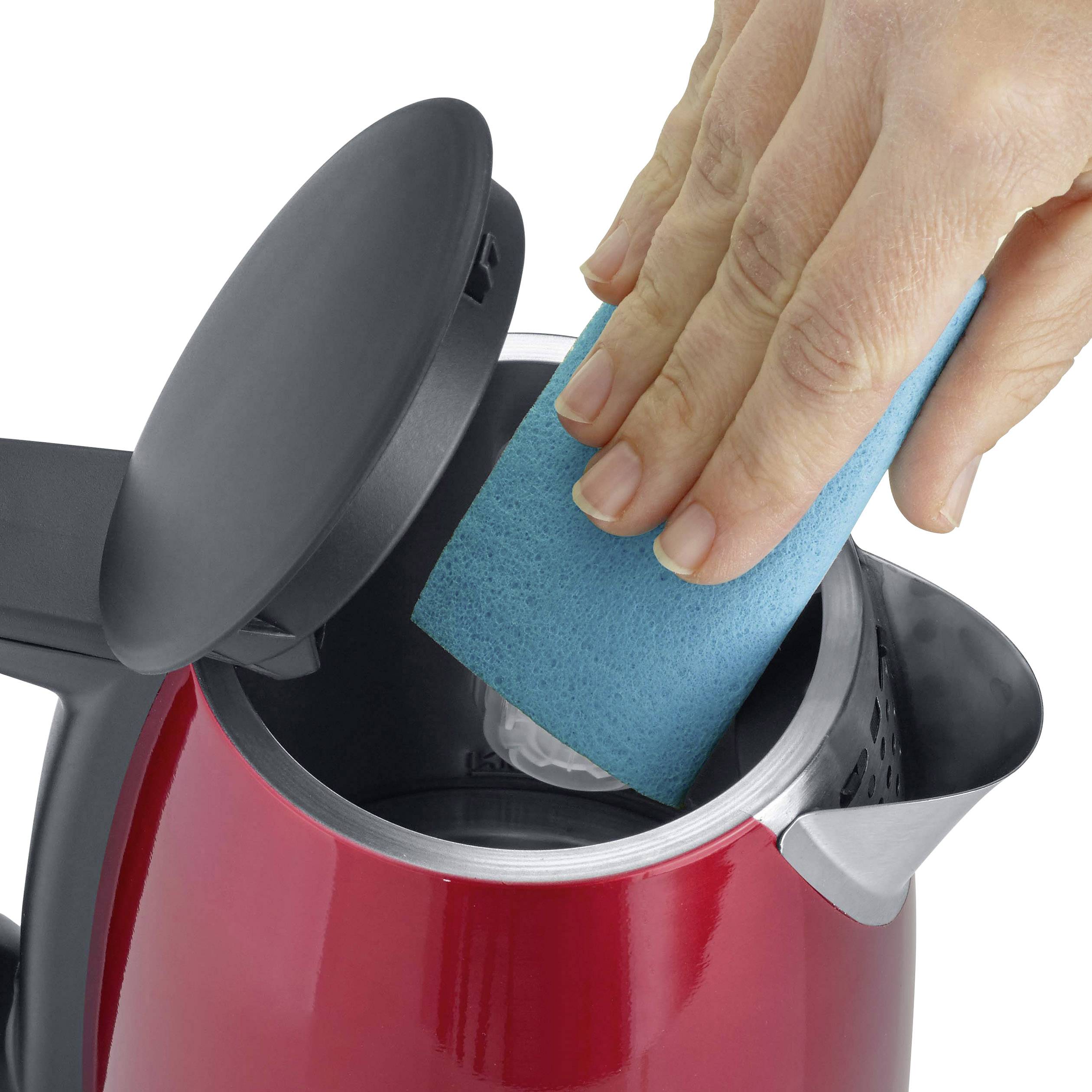 A hand is cleaning the inside of a red kettle with a blue sponge.