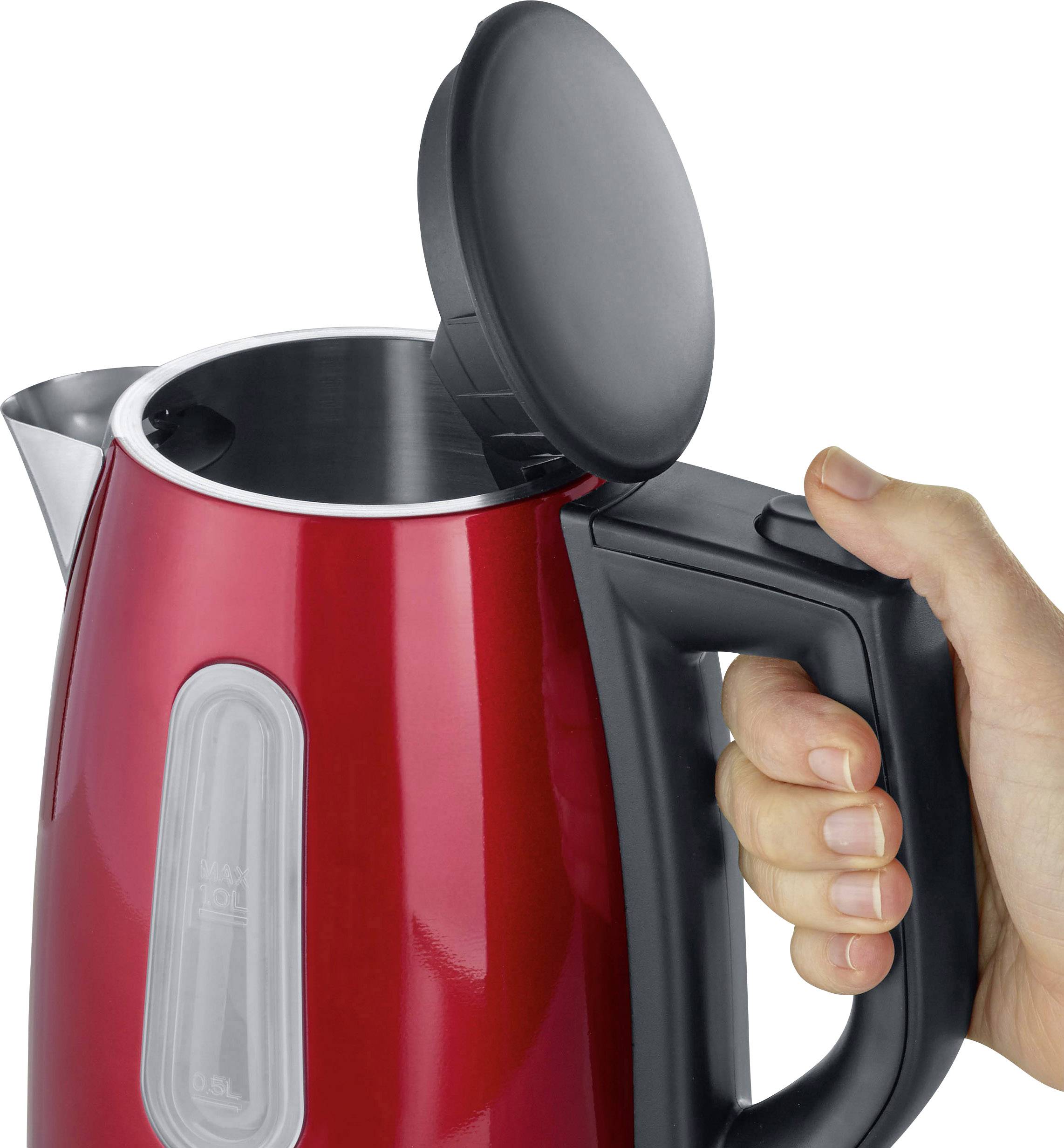 A hand is holding a red kettle with its lid open, ready to be filled with water.