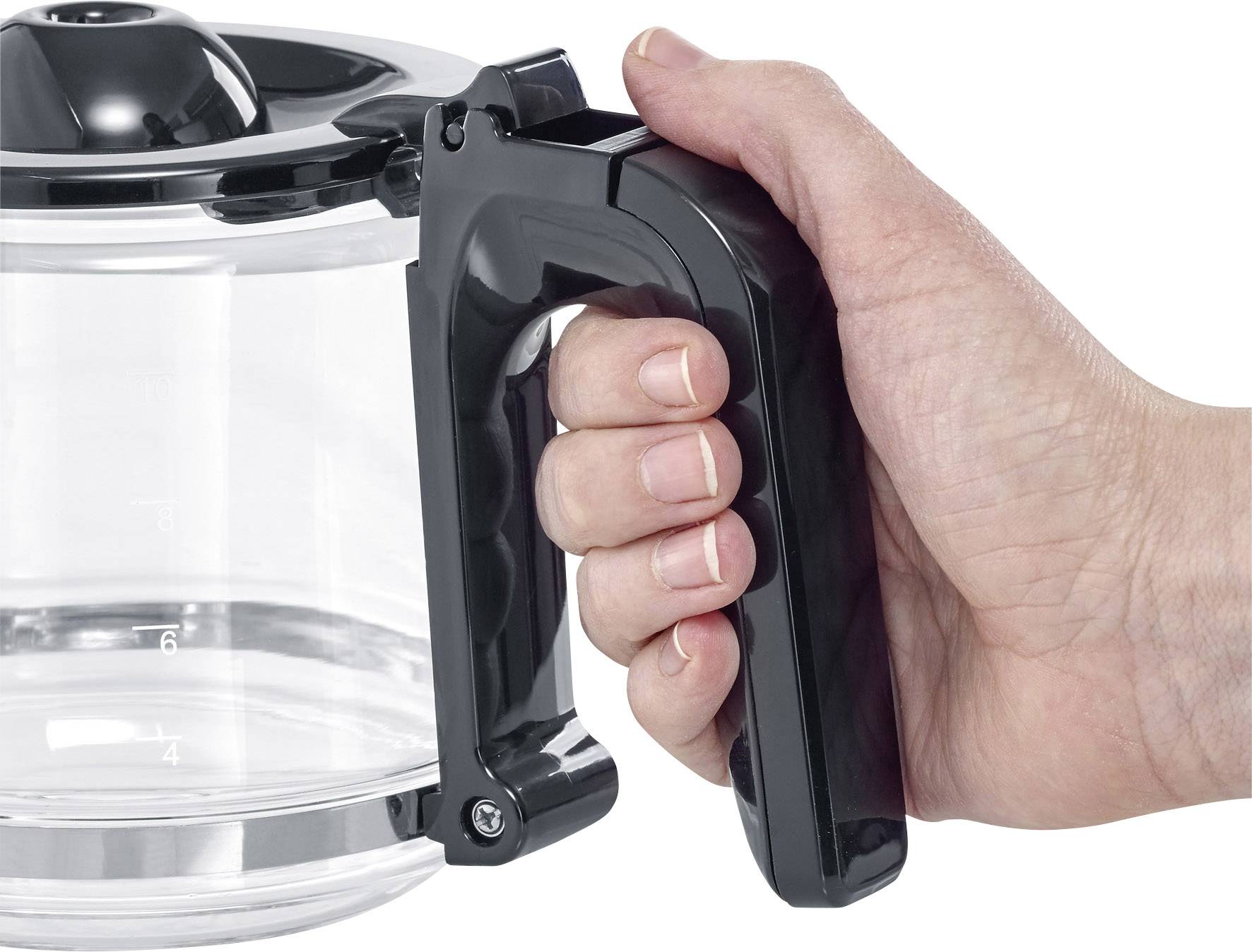 A hand firmly grips the black handle of a glass coffee pot.