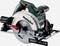 Electric hand circular saw with a green casing and silver saw blade. 'Metabo' company logo on the side.