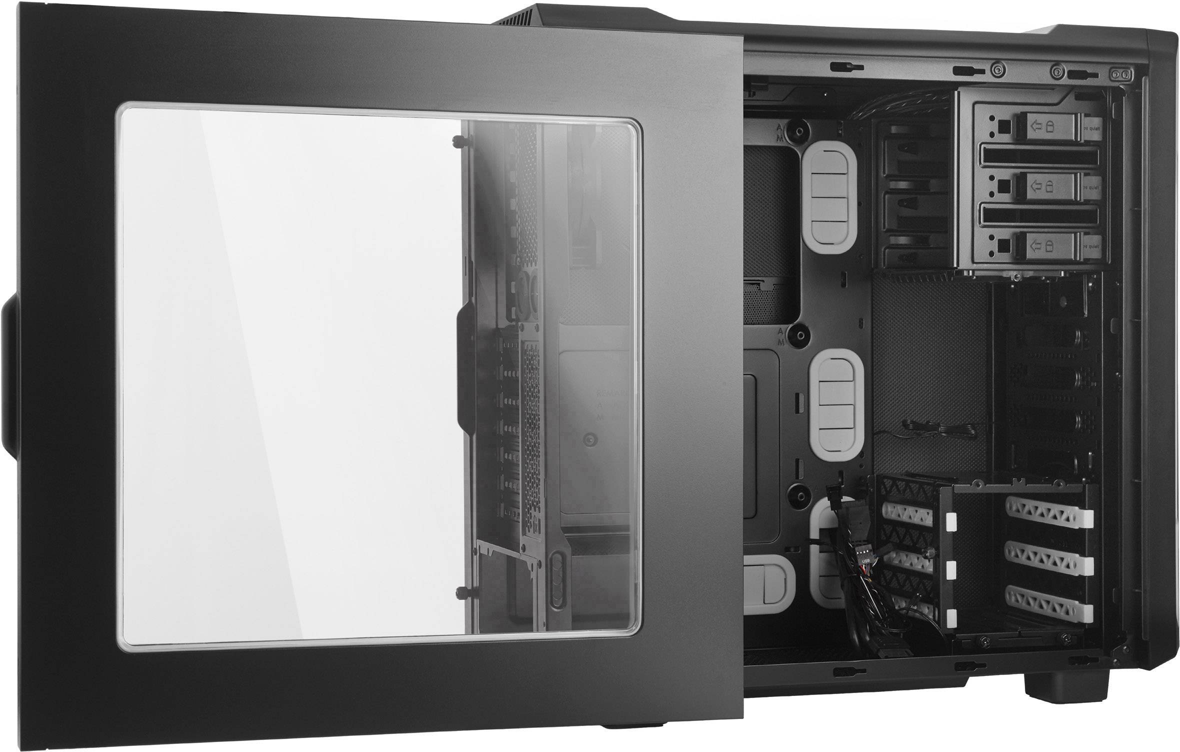 An open computer case with a transparent side panel, revealing the internal components with multiple drive bays and cables.