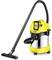 Yellow and black vacuum cleaner with a long suction hose, metal container, in an upright position.
