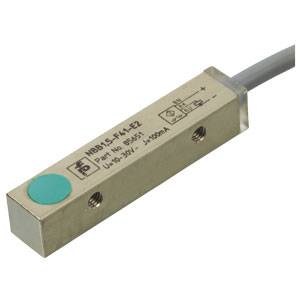 Industrial sensor by IFM with a rectangular metal housing and cable connection. Device details are visible on the surface.