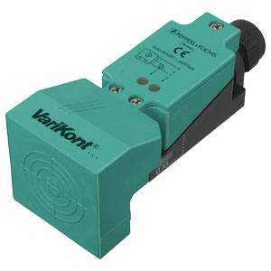 A green proximity sensor with the inscription 'Varikont'. Suitable for industrial applications to detect objects in motion.