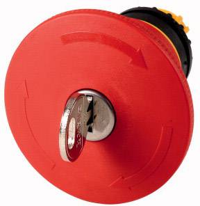 A red emergency stop switch with a key in the centre, surrounded by arrows indicating the rotation direction.