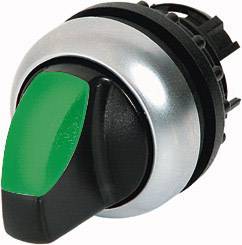 A round switch with a green and black surface, surrounded by a silver ring. The switch is in the neutral position.