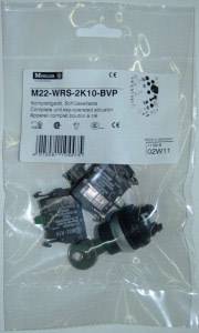 A set of electrical switch components in a plastic bag with a label displaying product specifications and manufacturer details.