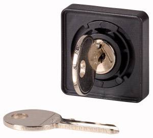 Two silver keys, one inserted in a black lock and the other lying beside it.