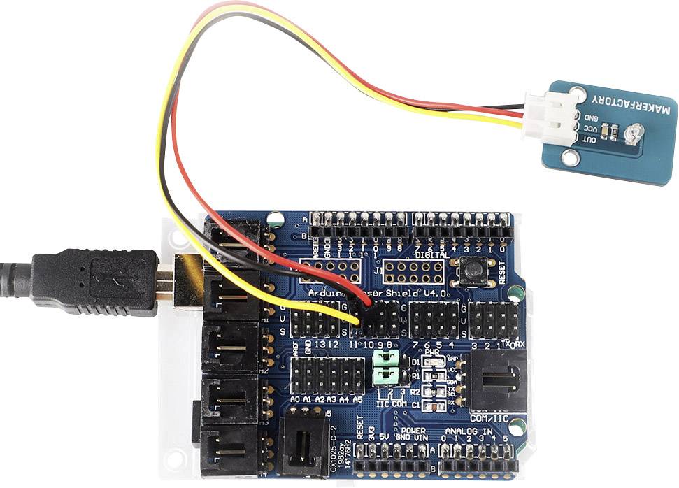 An Arduino shield with a connected MQ gas sensor. Cables connect the sensor to the breadboard, which is linked via a USB cable.