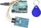 Arduino Uno board with connected RFID reader and blue RFID key fob.