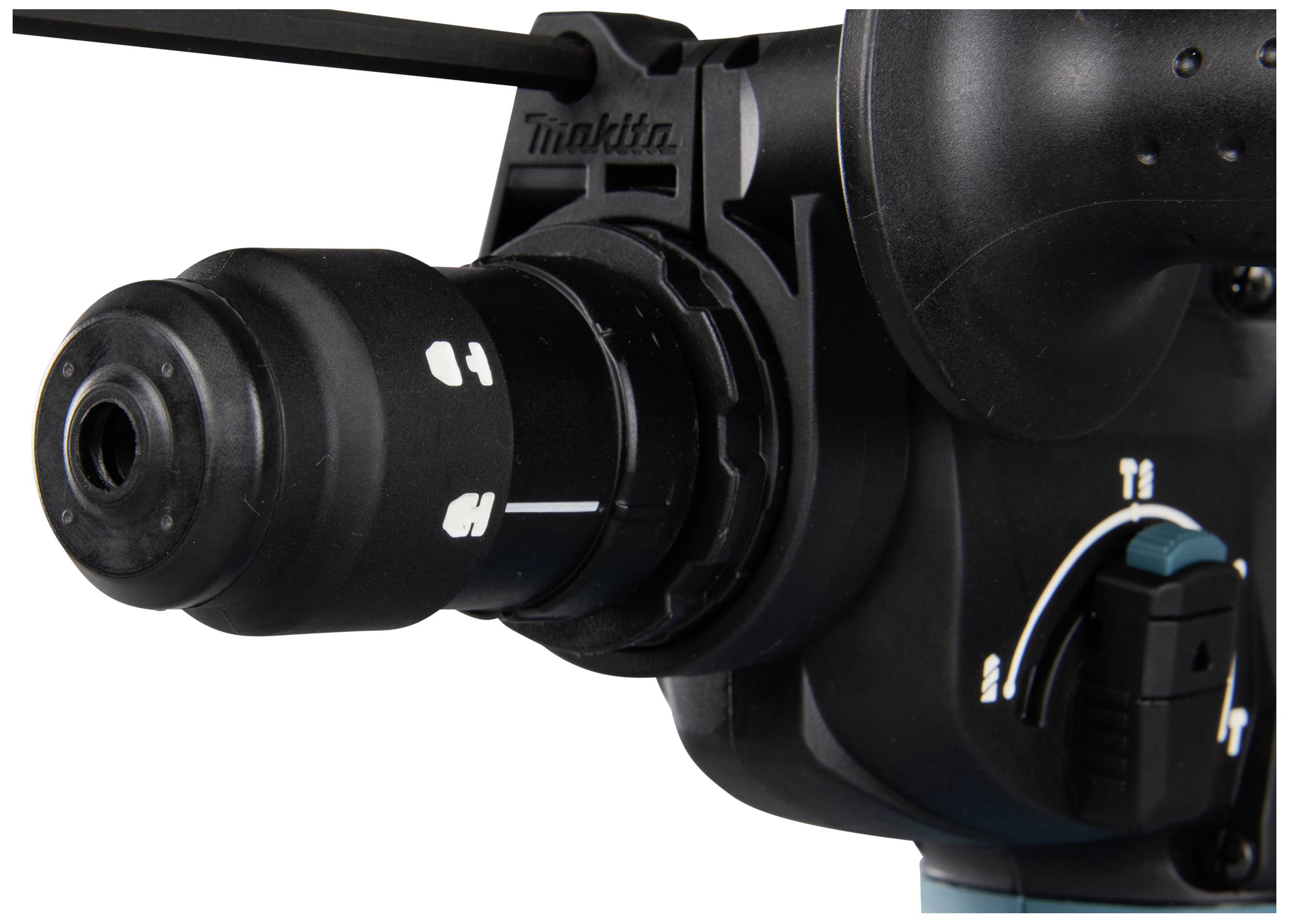 A close-up of a black drill with a rotary selector switch.