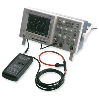 'Oscilloscope with connected measuring device shows a sinusoidal waveform on the screen, various control elements visible.'