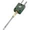 A thermocouple with a green plug and two metal contacts. It is used for temperature measurement in technical and scientific applications.