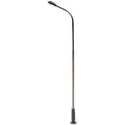 A long brass dishwashing lever with a black handle and angled end. A tool for performing specific household tasks.
