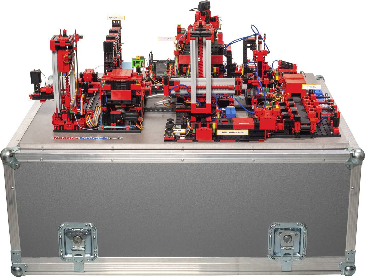 A complex machine comprising red and black components mounted on a metal casing, likely a technical or mechanical training unit.