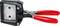 A tool with red handles, a black metal body, and a square metal opening, likely used for punching or cutting.