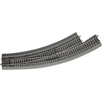 Two-track railway line with a points system that directs the train onto an alternative track. The tracks are set on a grey surface.