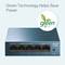 A blue TP-Link switch with five Ethernet ports, alongside a logo with text 'Green Technology', promoting energy-efficient technology.