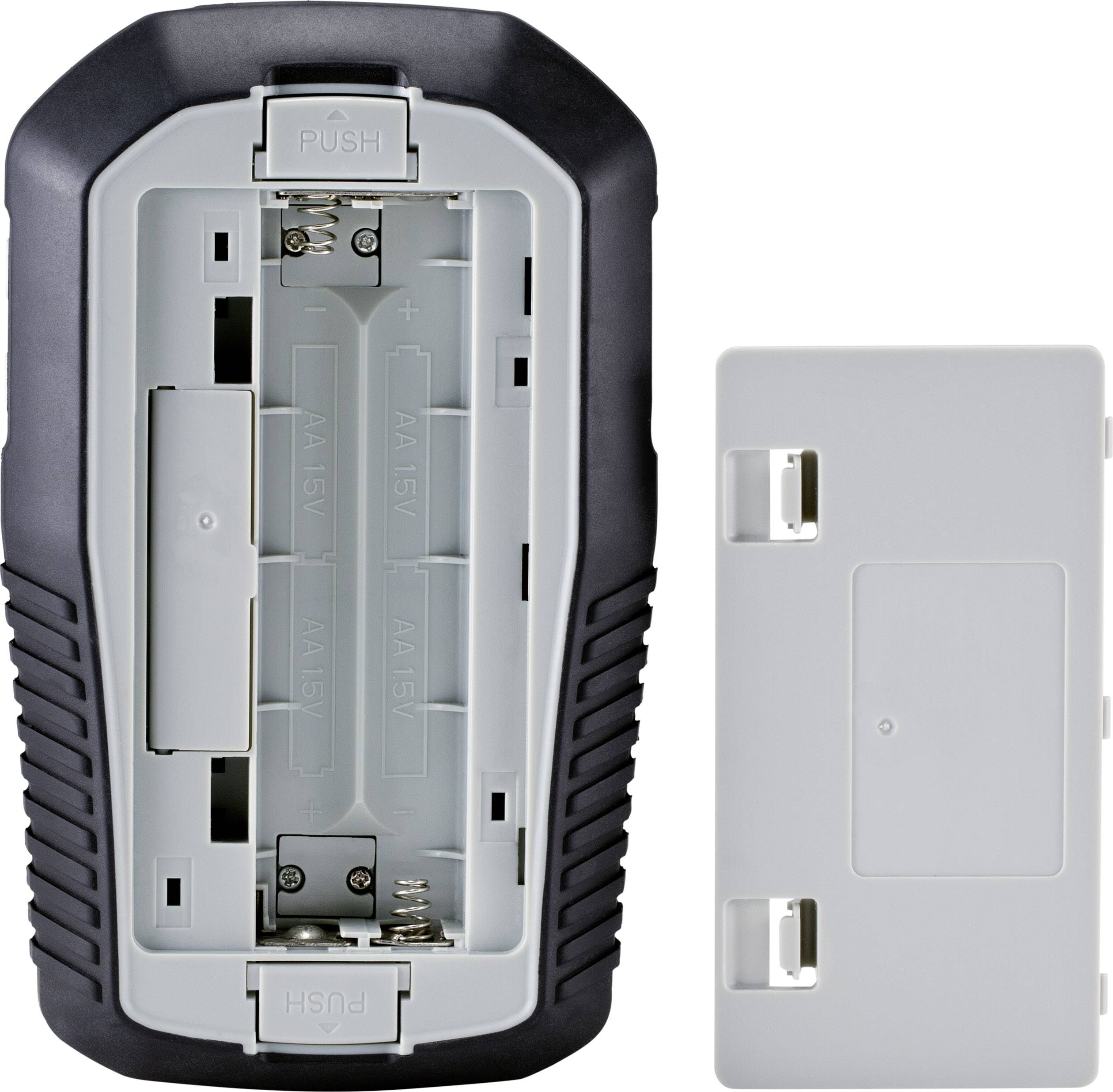 'An opened battery compartment of an electronic device with space for two AA batteries next to a removed cover.'