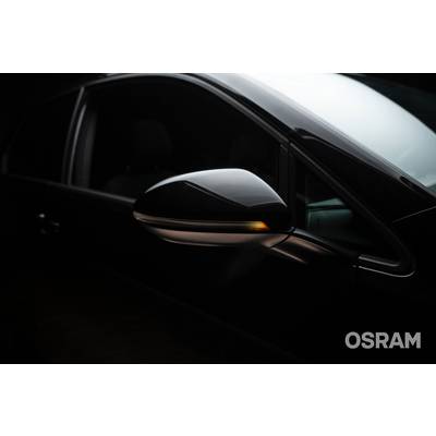 A car wing mirror with an activated indicator, in a dark ambient setting. 'OSRAM' brand name visible in the bottom right corner.