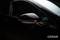A car wing mirror with an activated indicator, in a dark ambient setting. 'OSRAM' brand name visible in the bottom right corner.