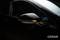 Car headlamps and side mirrors with indicators activated in a dark environment. 'OSRAM' text in the corner.