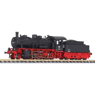 A black steam locomotive with a red undercarriage stands on a railway track. It has historical characteristics and appears well-preserved.