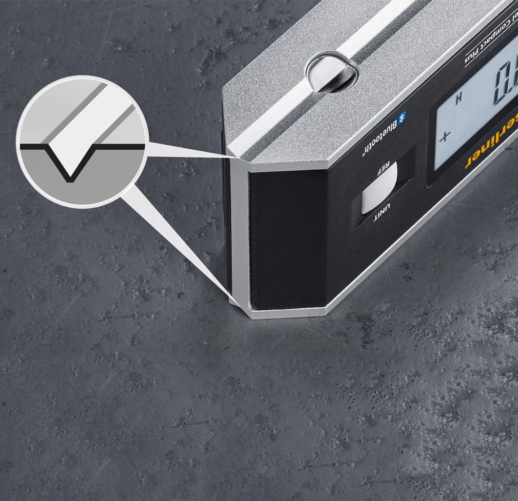 Electronic angle measuring device on a metal surface, showing a precise angle. Close-up with highlighted display area.