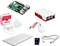 A Raspberry Pi set with motherboard, case, power supply, mouse, keyboard, HDMI cable, and microSD card.