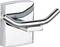 Silver metal double towel hook with a shiny surface, mounted on a smooth, rectangular base.