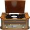 A retro record player with an open lid is playing a black vinyl record. The device has a wood-like finish.
