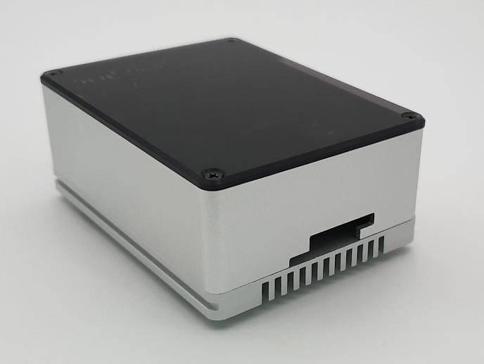 A rectangular metal enclosure with screws at the corners and ventilation slots on the side.