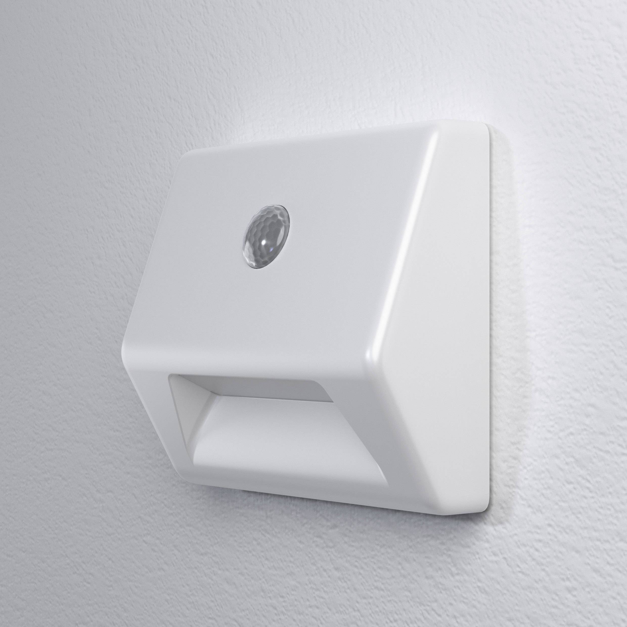 A white wall light with an integrated motion sensor, mounted on a light grey wall, for illuminating rooms or corridors.