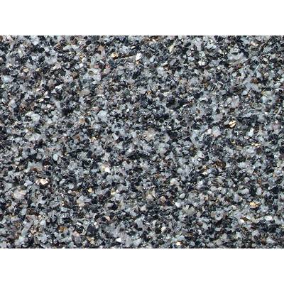 Close-up of an asphalt surface with a coarse-grained texture, composed of small, multicoloured stones and gravel.