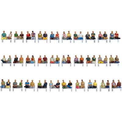 A row of miniature figures, dressed in colourful clothing and seated on benches, symbolises diversity and community.