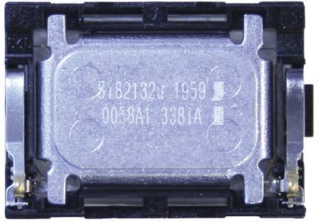 A small, rectangular electronic component in silver and black, possibly an internal device component.