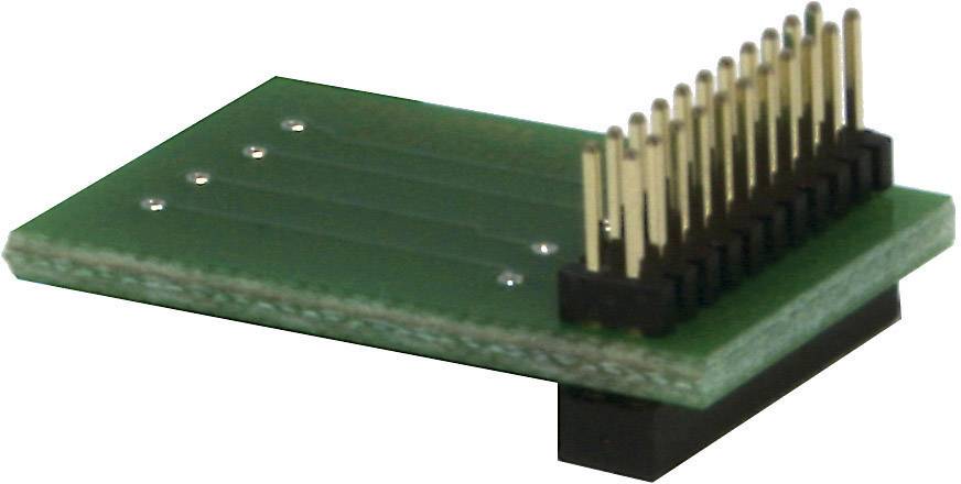A green electronic printed circuit board with multiple vertical pin headers used for connections in electronic circuits.