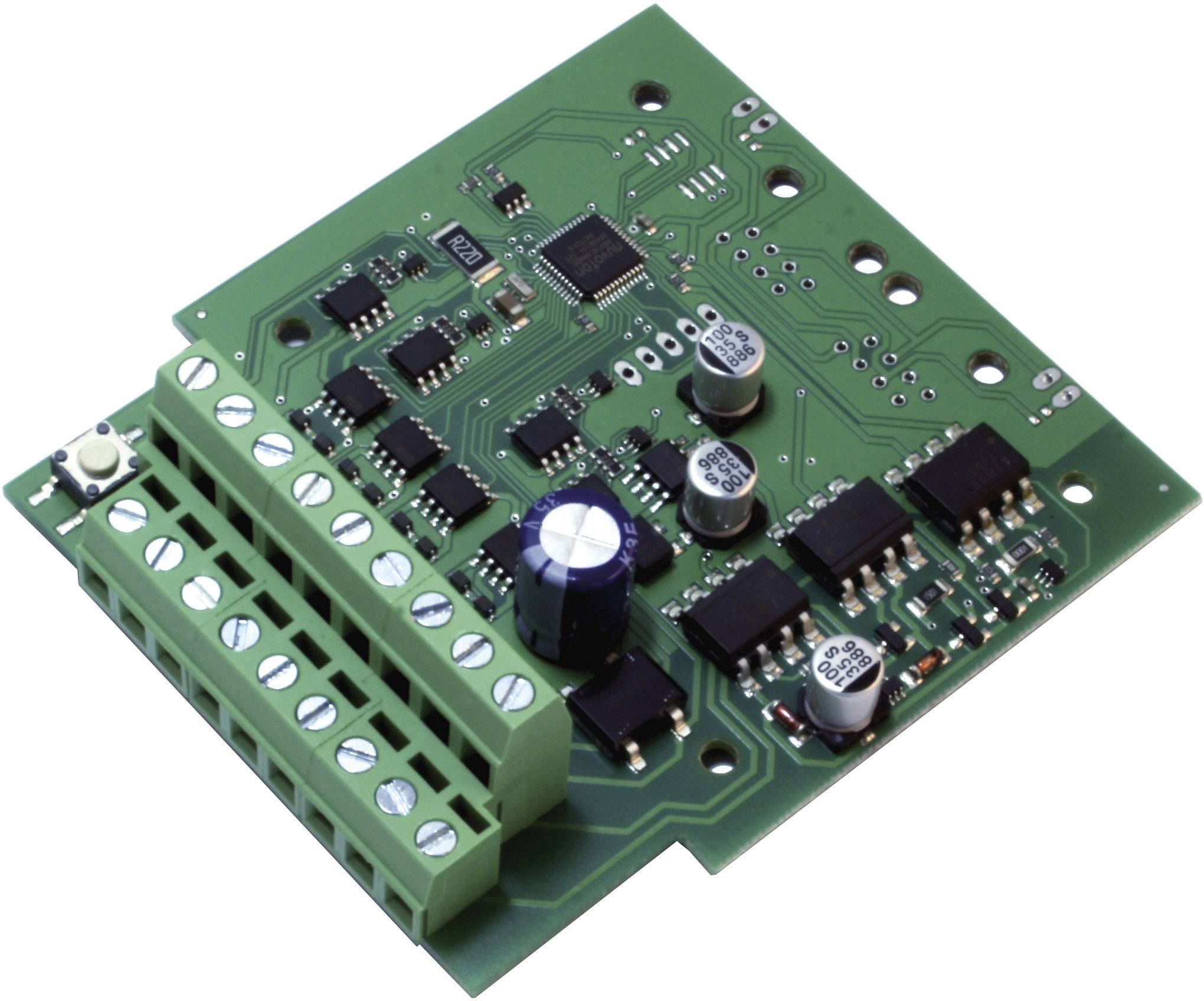 A green electronic circuit board with multiple integrated circuits, capacitors, and resistors, shows components of a control board.