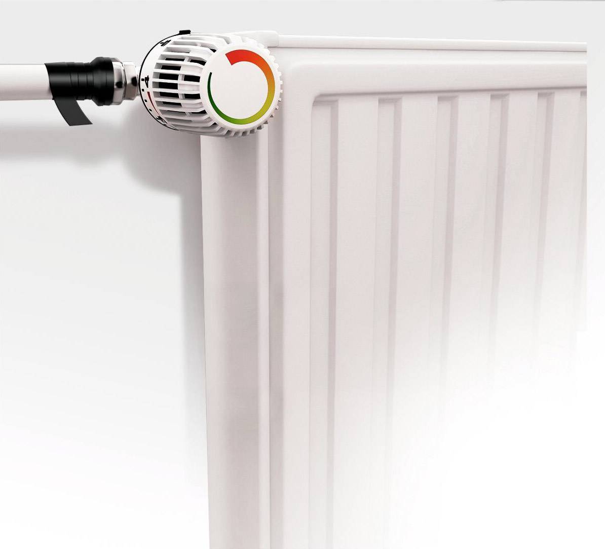 A white radiator with a heating controller, whose scale ranges from green to red.
