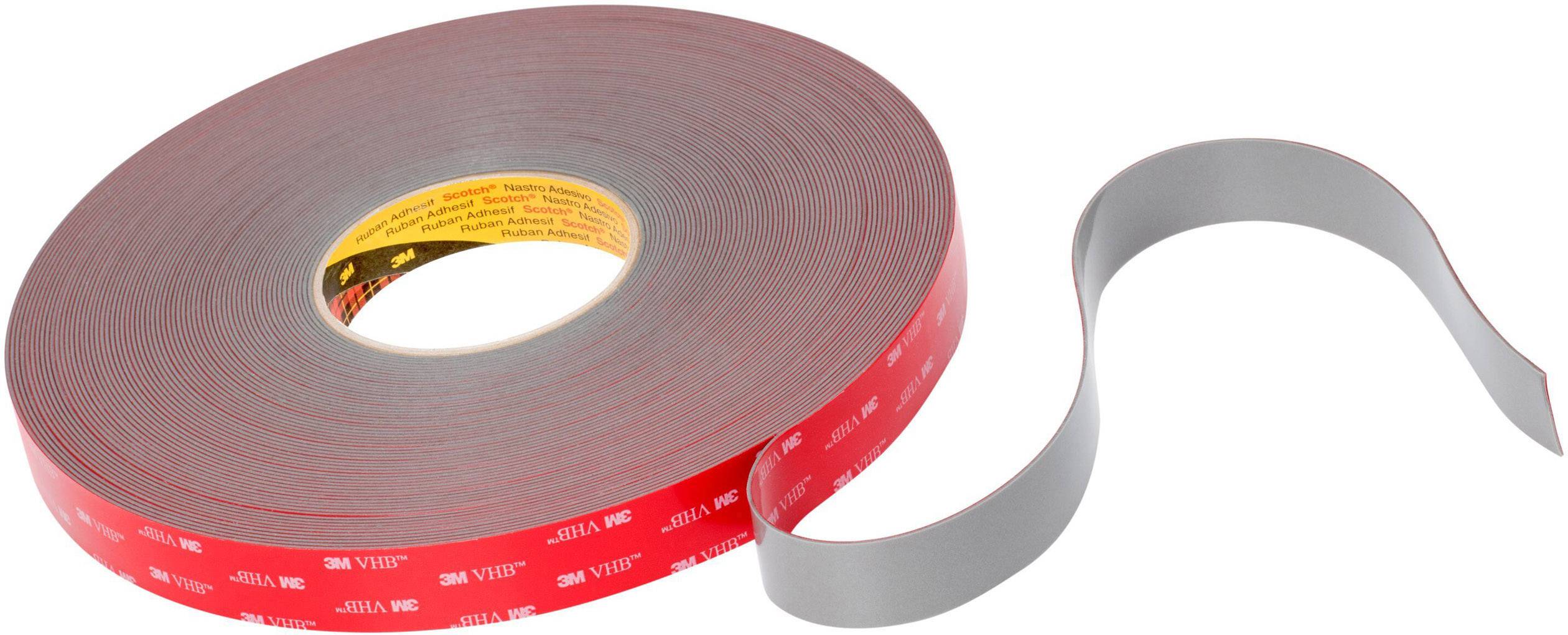 A roll of red adhesive tape, partially unrolled.