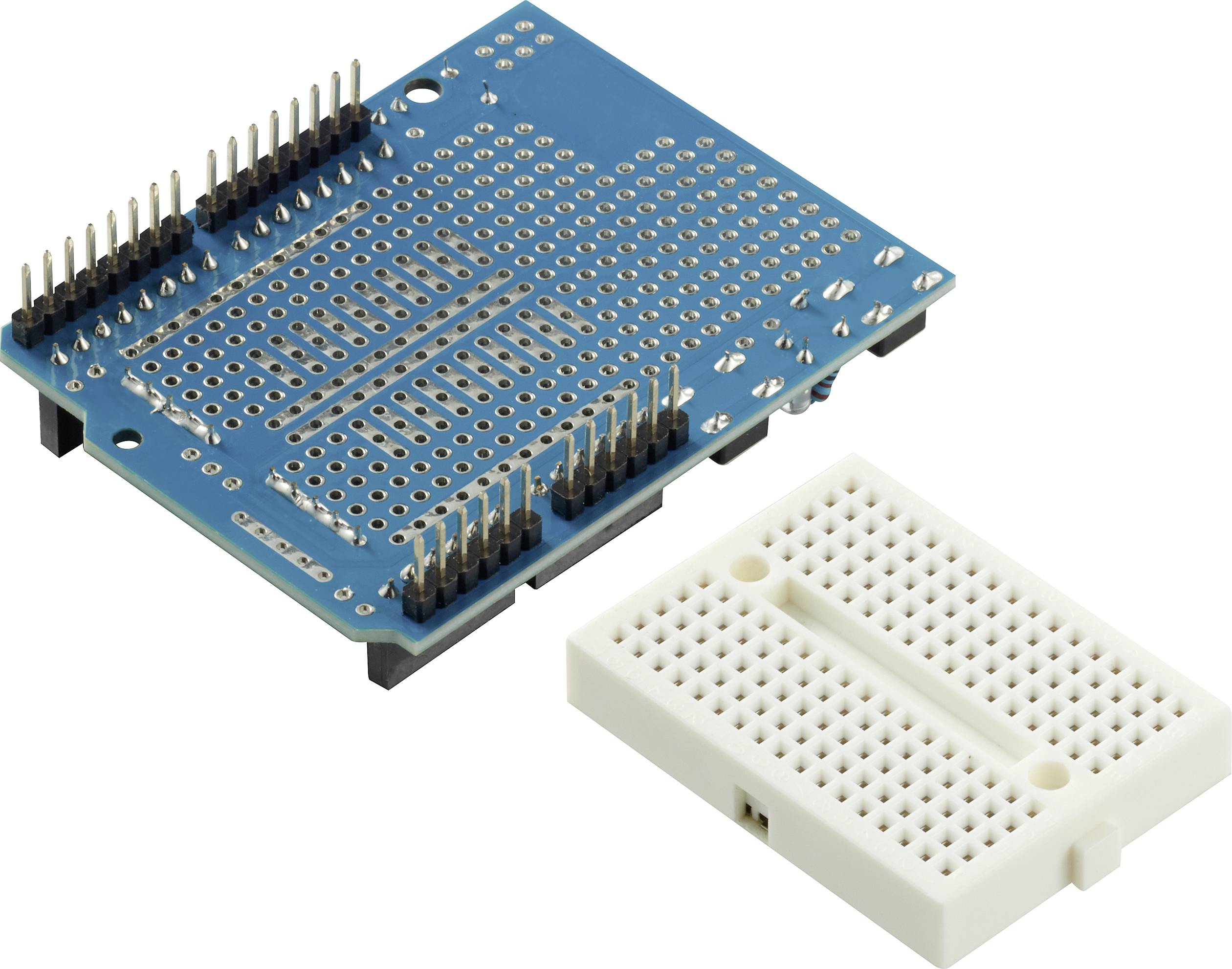 A blue Arduino shield with multiple pins next to a white breadboard. Both are used for electronic circuit prototyping.